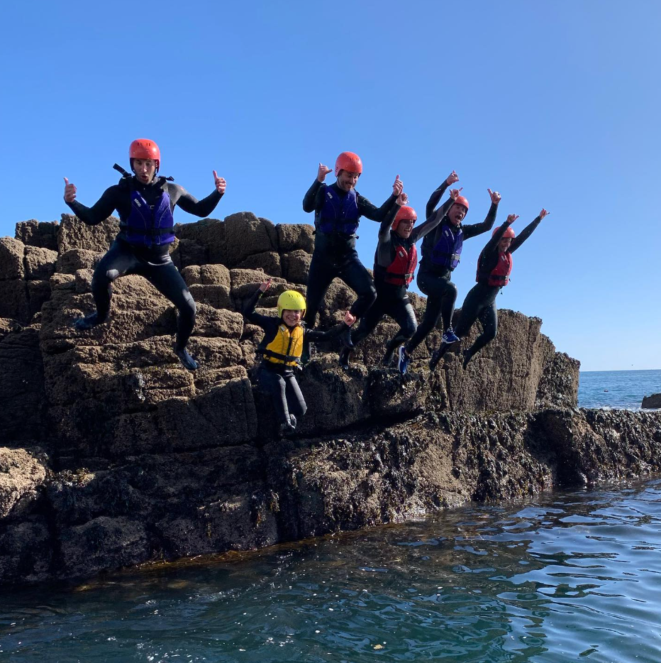 Group coasteering on the Lizard Peninsula, south Cornwall