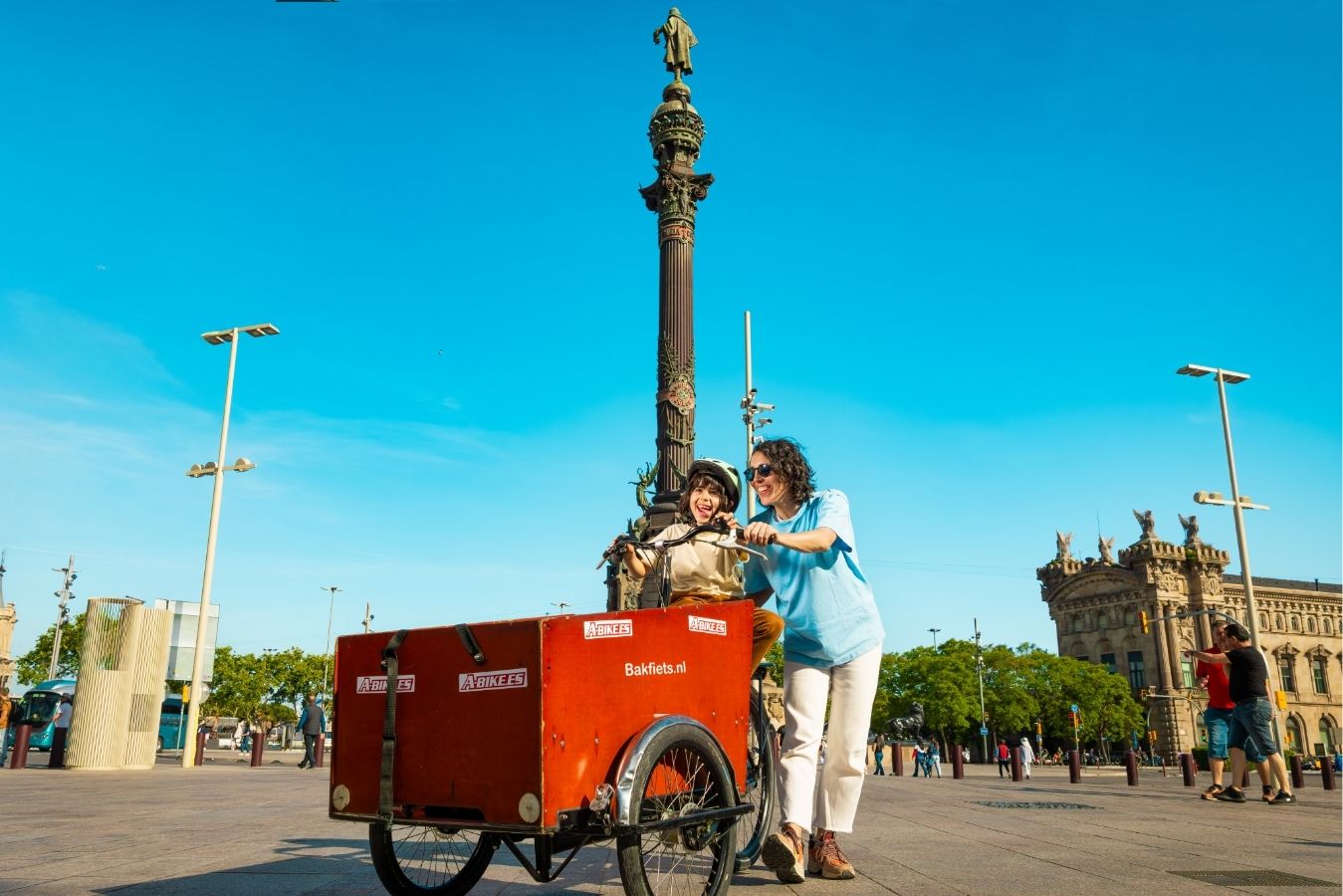 A cargo bike by the Columbus monument in Barcelona