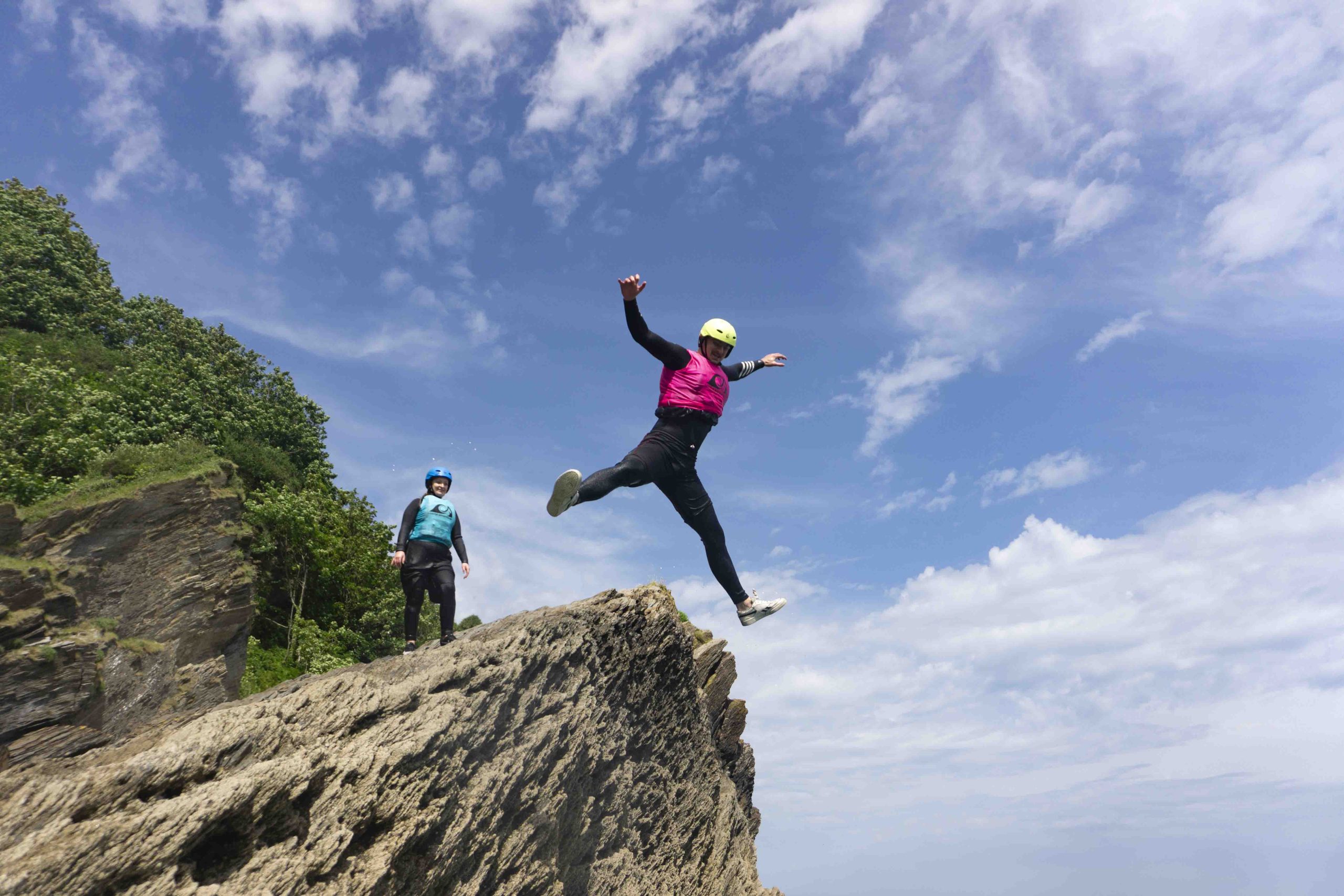 Coasteering kit — wetsuit, buoyancy aid, and helmet