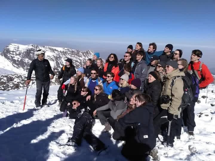 Trekkers on a rocky trail in the High Atlas Mountains of Morocco