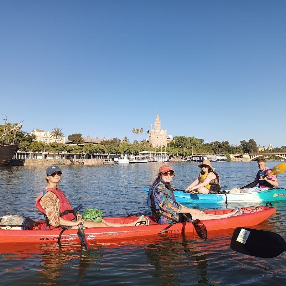Kayaks on the Guadalquivir with Torre del Oro in Seville