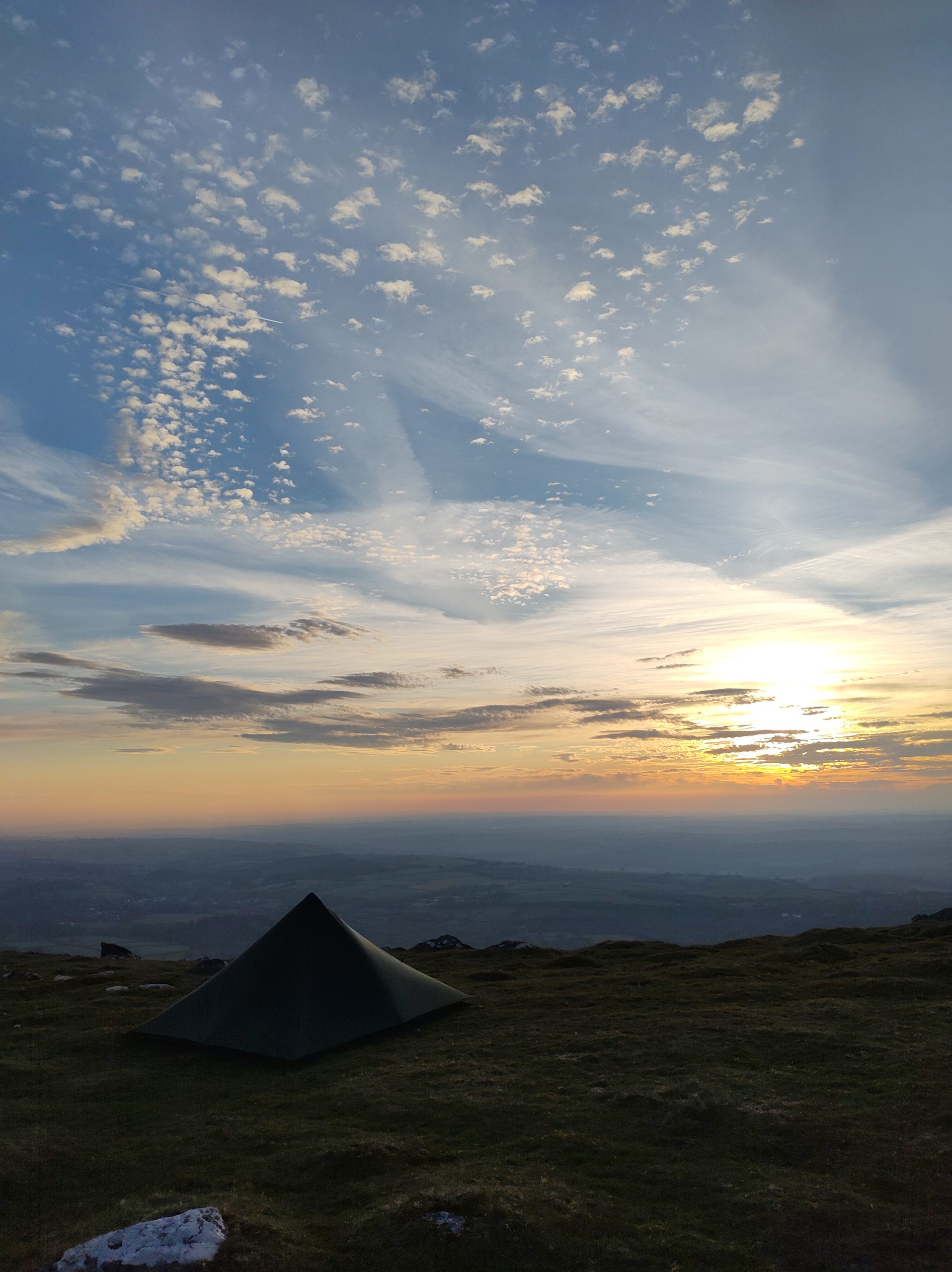 Tent pitched on open moorland at dusk on Dartmoor